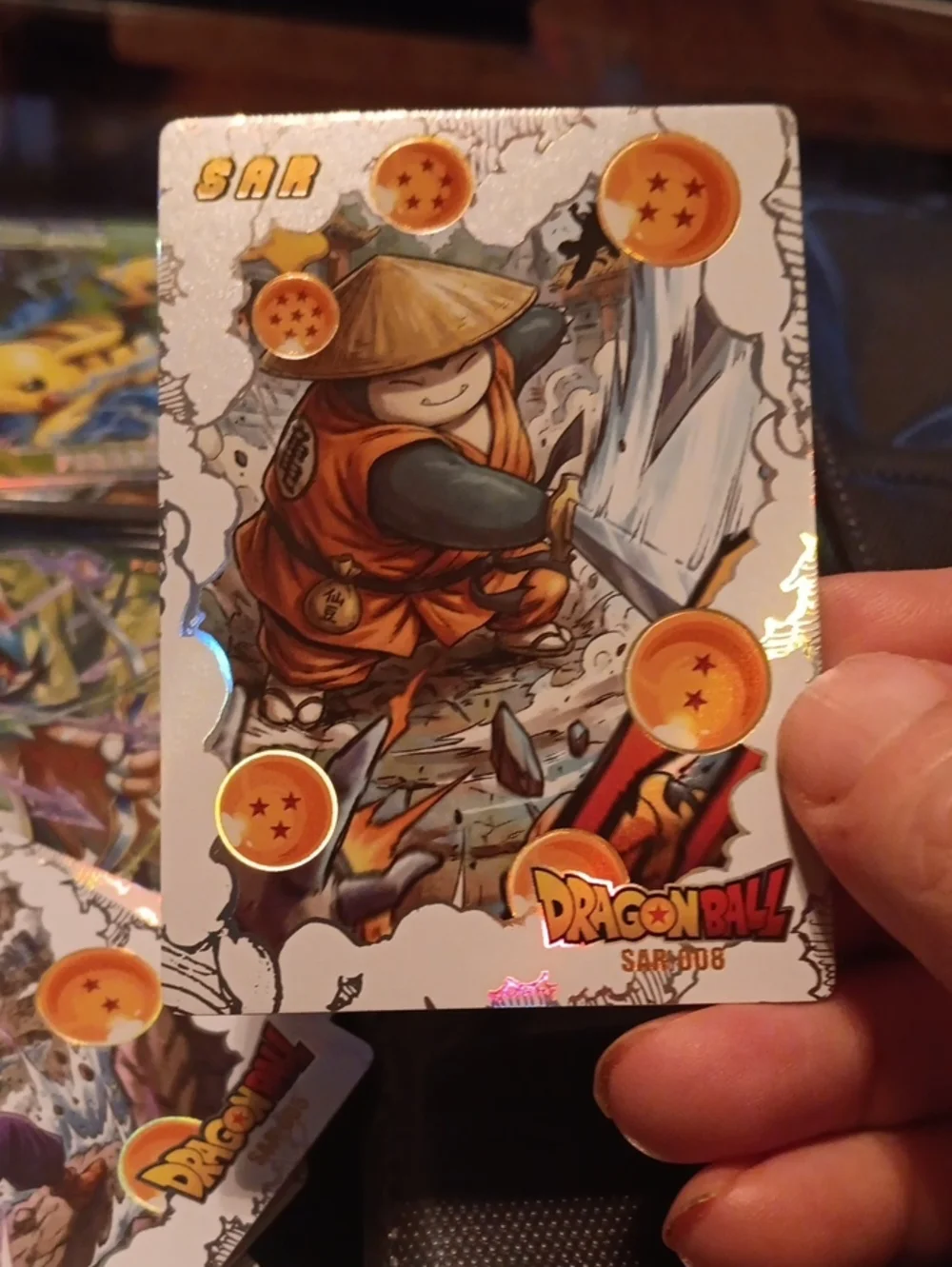 Pokemon trading card with orange and gold accents